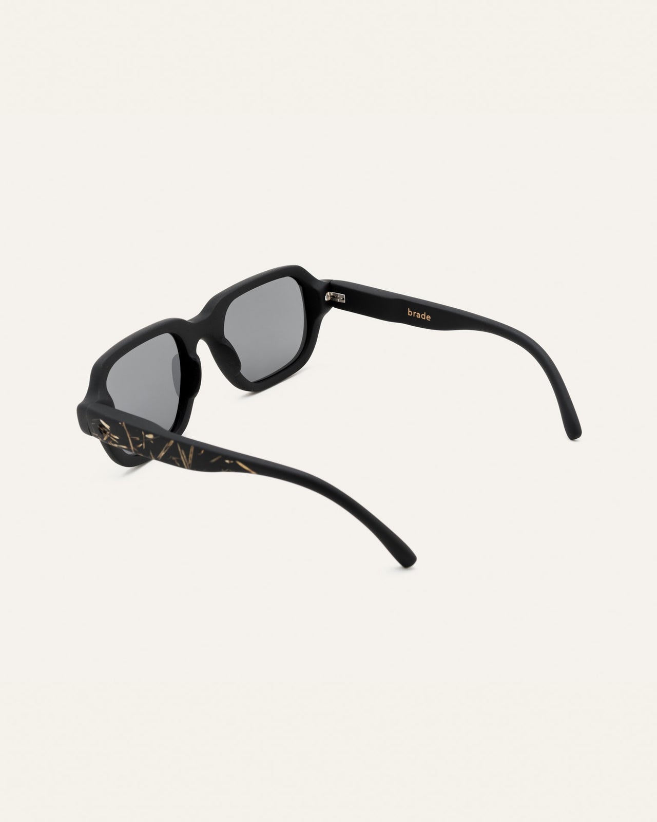 Load image into Gallery viewer, Side view of black sunglasses with flax accents, modern and natural aesthetic.
