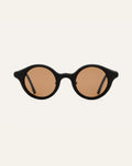 Round black sunglasses with warm brown lenses, crafted from sustainable coffee-based materials for eco-conscious style.