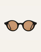 Round black sunglasses with warm brown lenses, crafted from sustainable coffee-based materials for eco-conscious style.