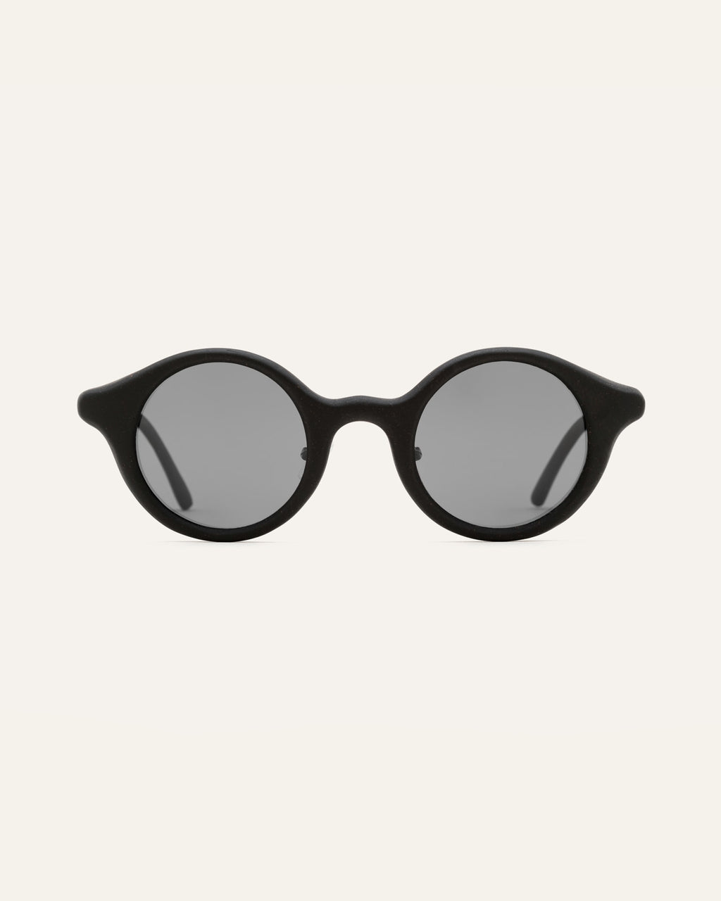 Round black sunglasses with gray lenses, designed for everyday comfort and style