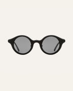 Round black sunglasses with gray lenses, designed for everyday comfort and style