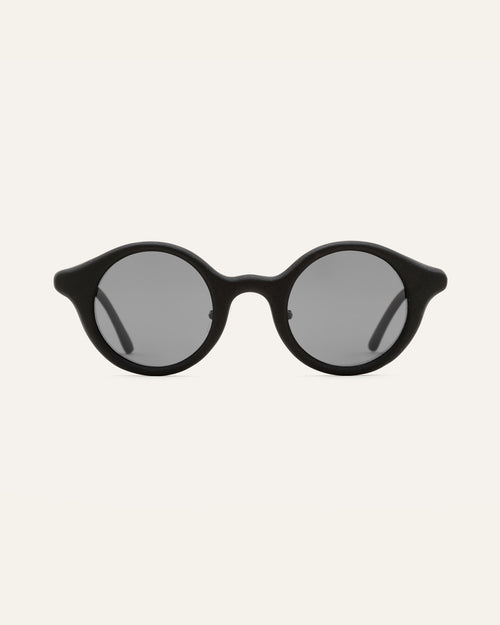 Round black sunglasses with gray lenses, designed for everyday comfort and style