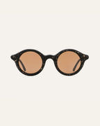 Black sunglasses with brown lenses and natural flax texture, combining eco-friendly materials with unique design.