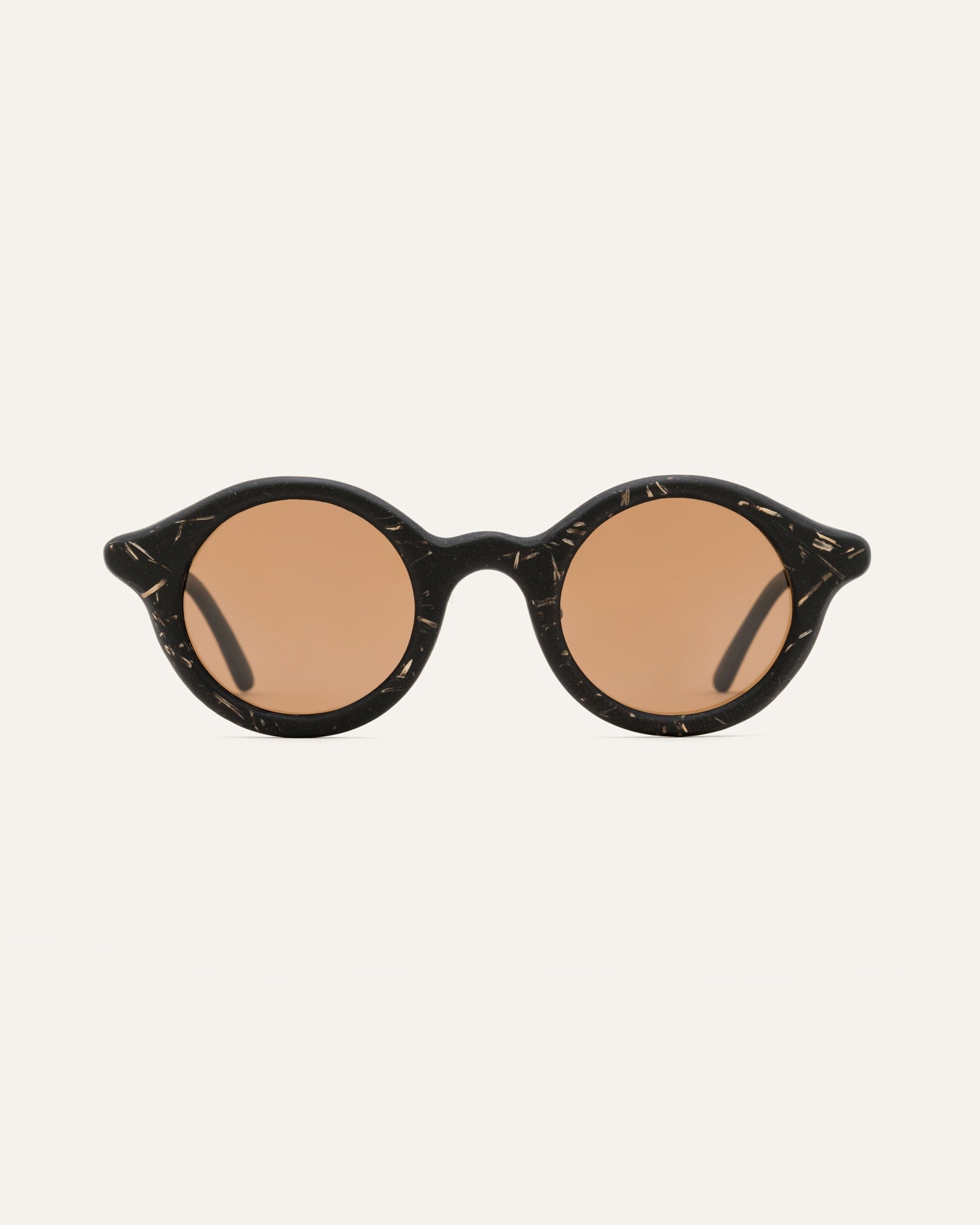 Black sunglasses with brown lenses and natural flax texture, combining eco-friendly materials with unique design.