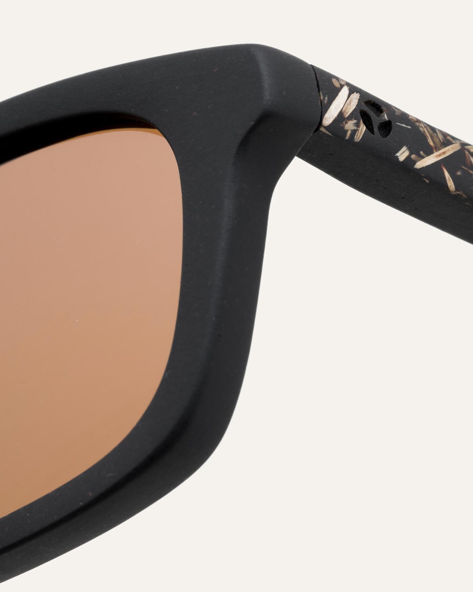 Close-up of the flax-textured temples and coffee-based frame, paired with warm-toned lenses for a natural look