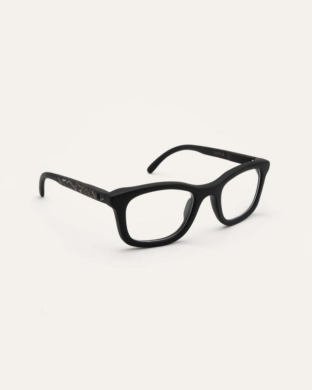 Angled view of Dandy optical frames with transparent lenses, showing their lightweight design and natural details