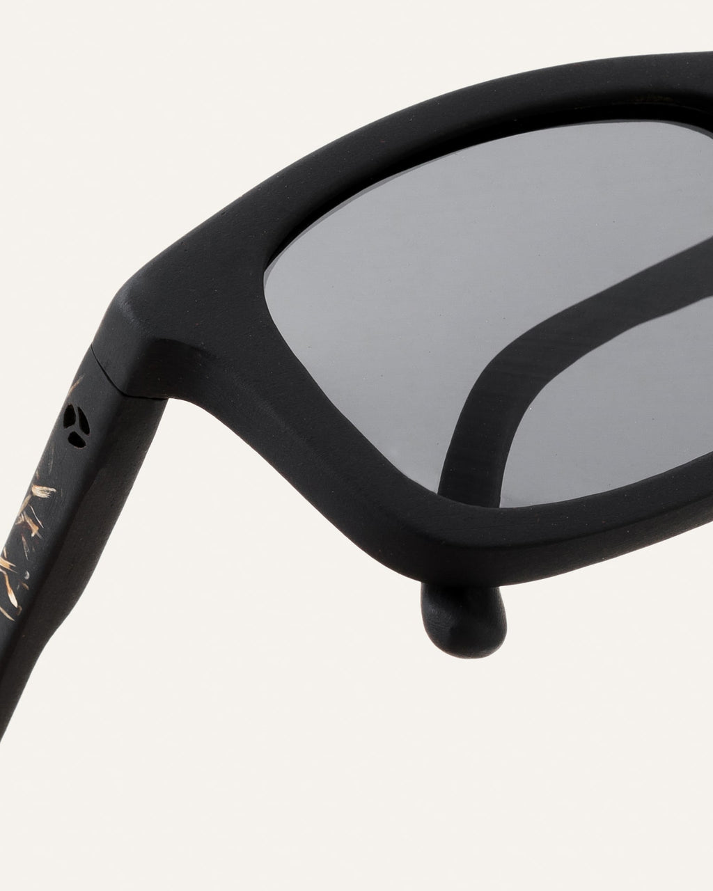 Close-up of gray lenses and textured frame with flax-infused details