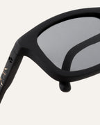 Close-up of gray lenses and textured frame with flax-infused details