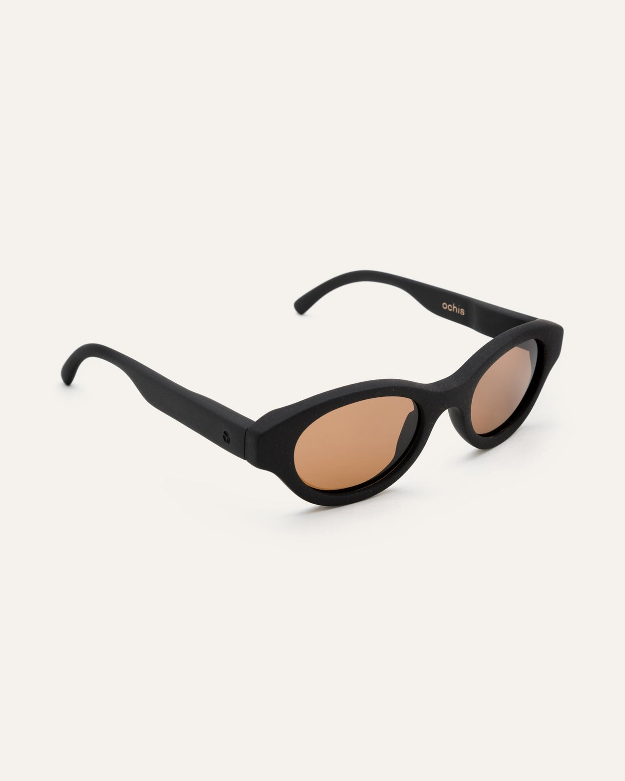 Load image into Gallery viewer, Lightweight Dayla sunglasses in a side view, crafted from coffee biopolymers and featuring brown lenses for eco-conscious living
