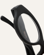 Detailed view of the black oval coffee-based frame, highlighting its smooth finish and sustainable craftsmanship