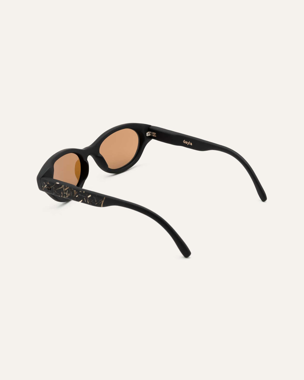 Side profile of biobased sunglasses with brown lenses, combining eco materials and a minimalist design