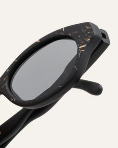 tinted oval-shaped sunglasses