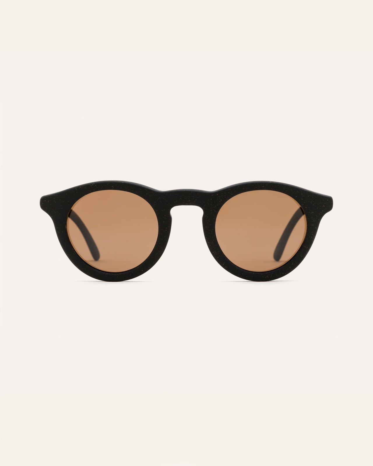 Load image into Gallery viewer, Black sunglasses with brown polarized lenses, offering UV protection and a sleek, minimalist design
