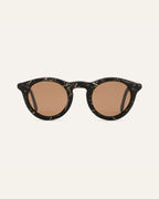 Black sunglasses with brown polarized lenses, featuring a unique texture of flax straw on the eco-friendly frames
